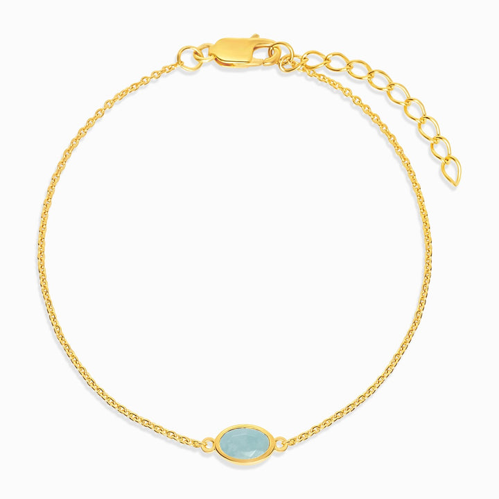 Gold bracelet with March's birthstone Aquamarine, which has a blue color. Crystal bracelet with blue crystal Aquamarine in gold.