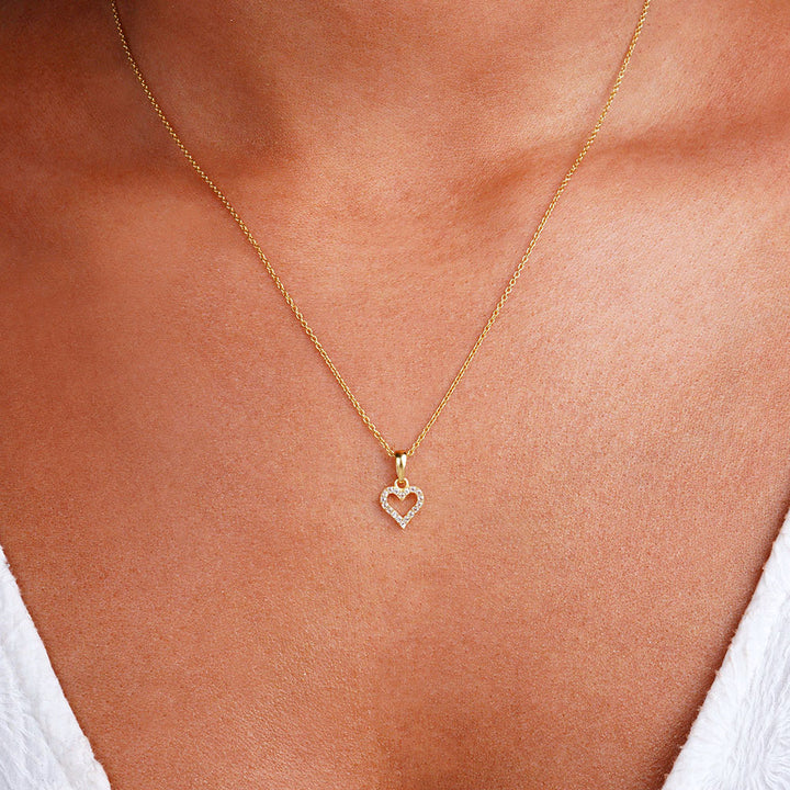  Gold necklace with heart and White Topaz crystals. Heart necklace with sparkling White Topaz crystals.