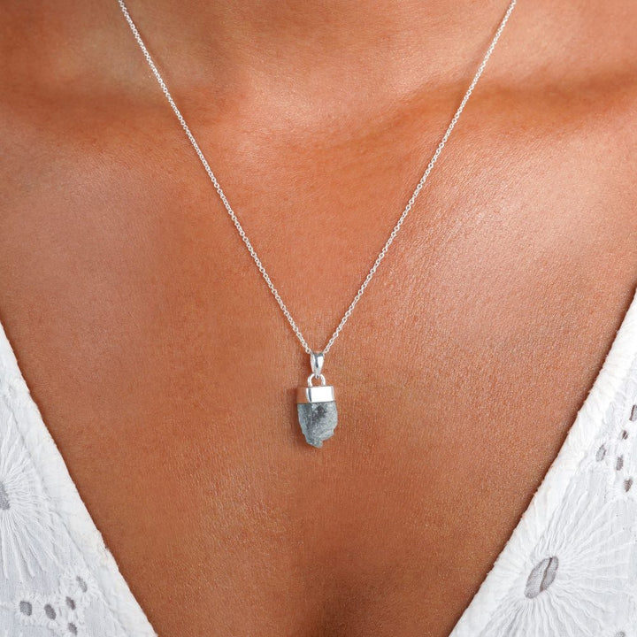 Raw Aquamarine necklace in silver. Blue raw gemstone necklace with Aquamarine in sterling silver.