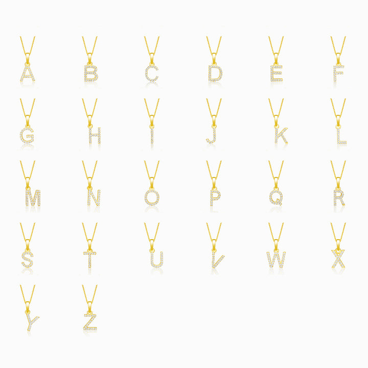 Letter jewelry collection in gold. Letter charms in gold filled with real crystals.