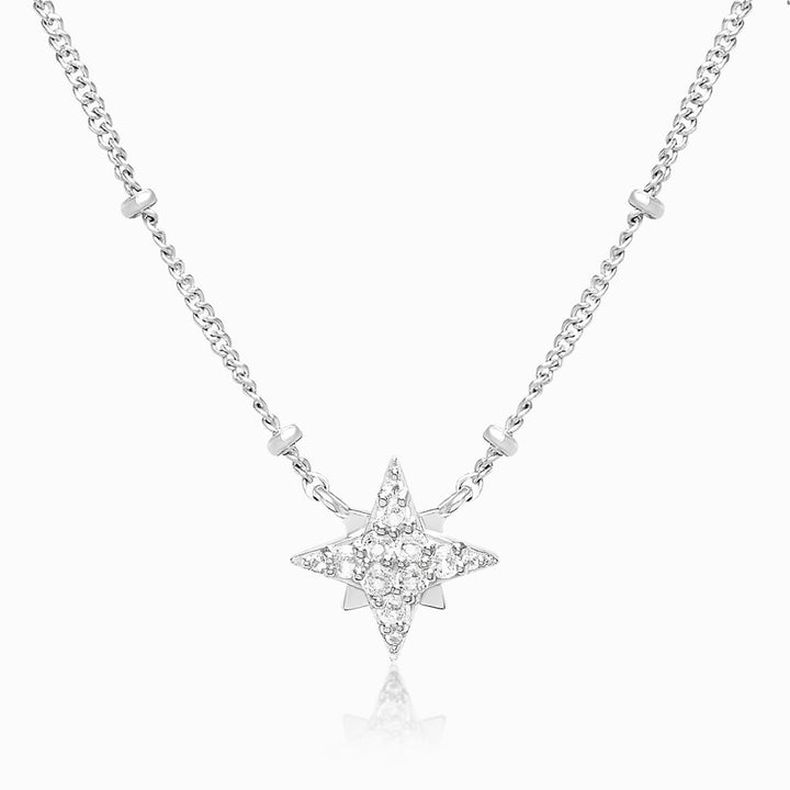 Star necklace in silver with small dots in the chain. Magic necklace in silver with star of crystals.