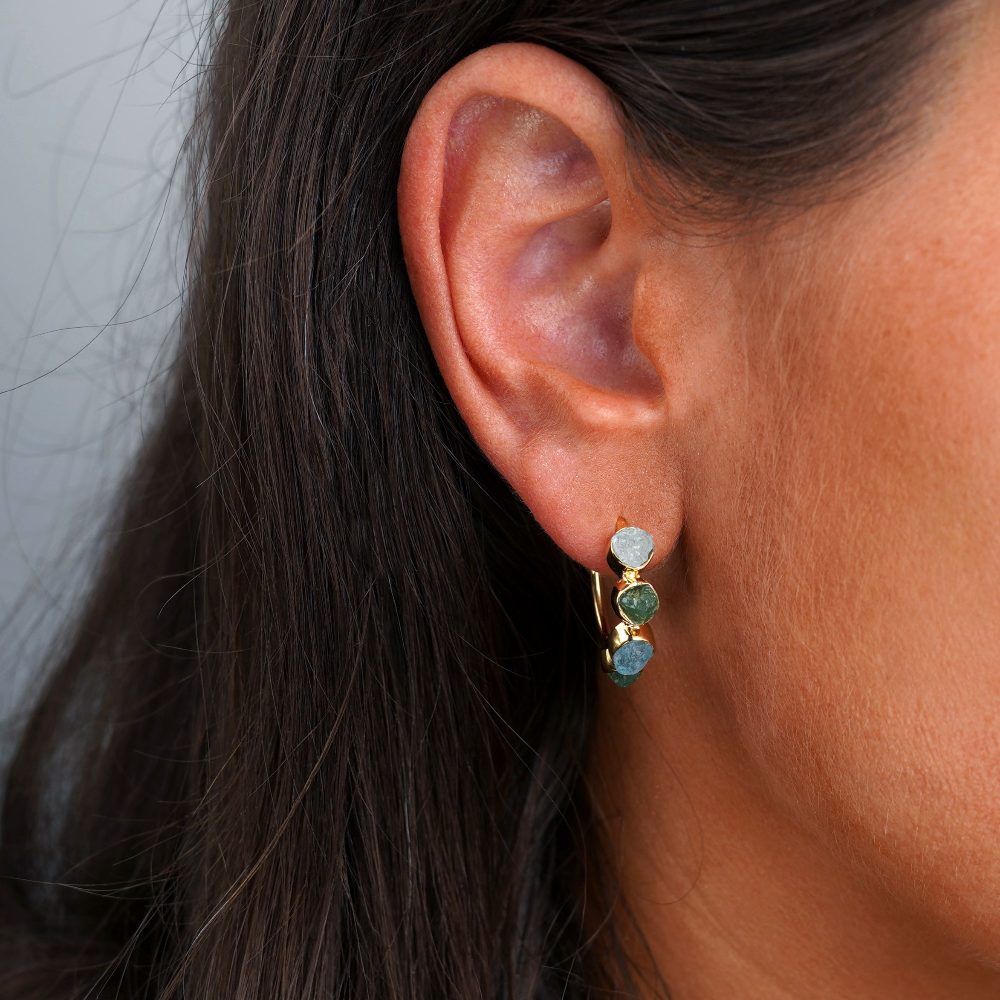 Gold earrings with raw gemstones in blue and green. Crystal earrings with Aventurine and Aquamarine in gold.