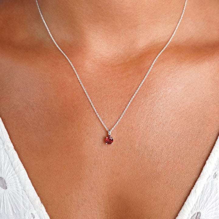 Jewelry with January's birthstone Garnet in silver. Crystal necklace with red Garnet which stands for passion, courage and strength.