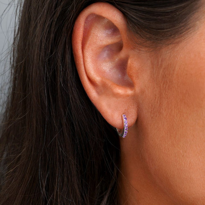 Silver hoop earrings with small Amethyst gemstones. Crystal earrings with tiny Amethyst gemstones.