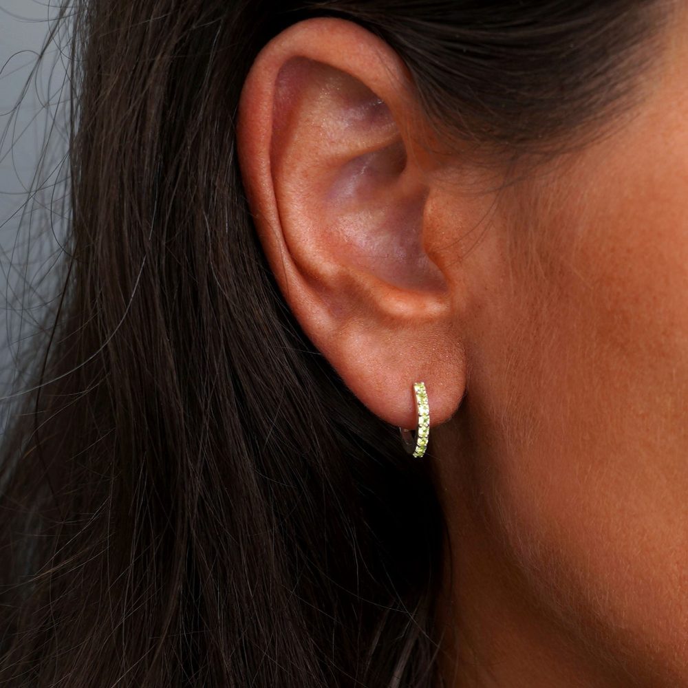 Silver earring with Peridot gemstones in hoops. Crystal jewelry with crystal earring.