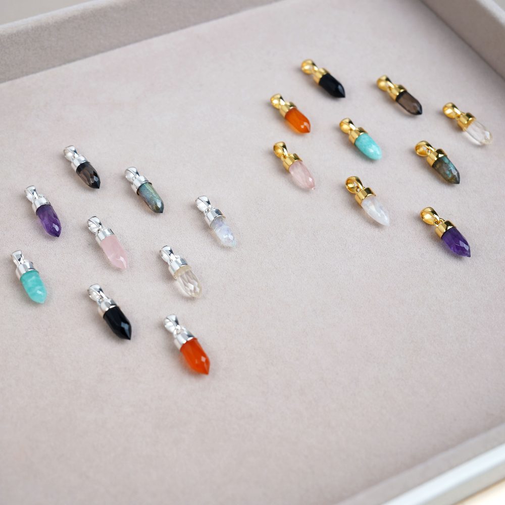 Gemstone mini points pendants in silver and gold. Crystal pendants with genuine gemstones formed to mini points.