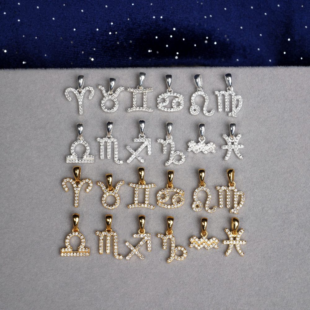 Zodiac collection jewelry in silver and gold. Gemstone jewelry with zodiac signs.