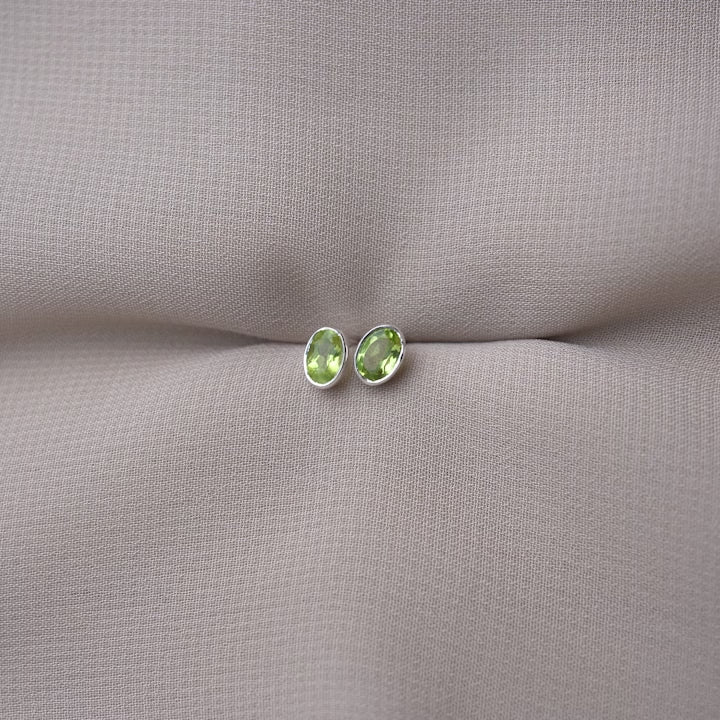 Silver earrings with Green gemstone Peridot. August birthstone earrings in a modern design with Peridot.