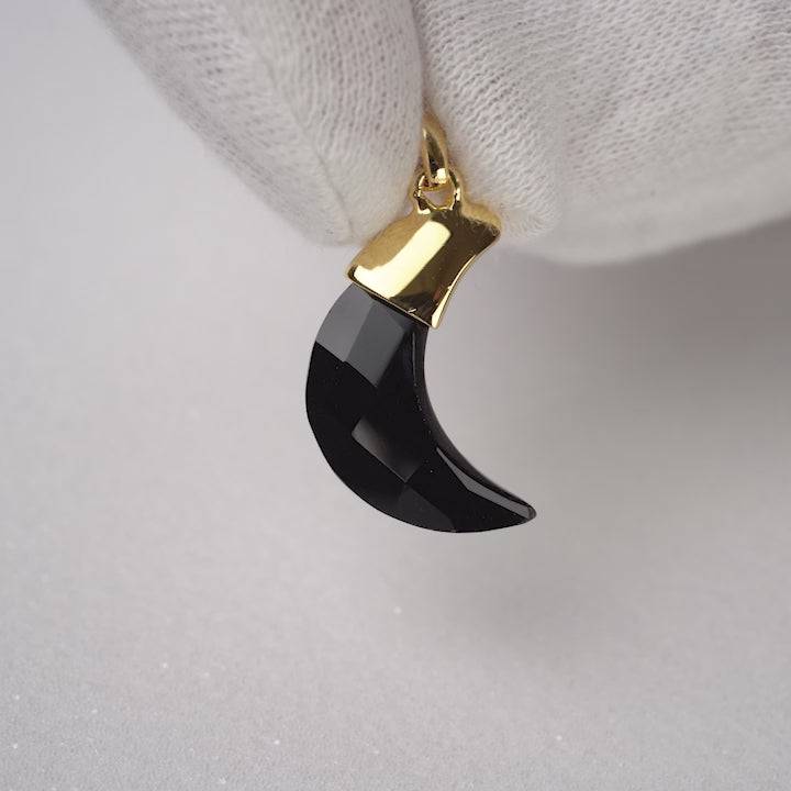 Moon shaped Onyx gemstone pendant with gold. Crystal moon pendant in Onyx and gold details.
