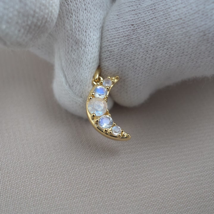 Moon pendant in gold with magical Moonstone crystals. Gemstone moon jewelry with crystals that sparkle.