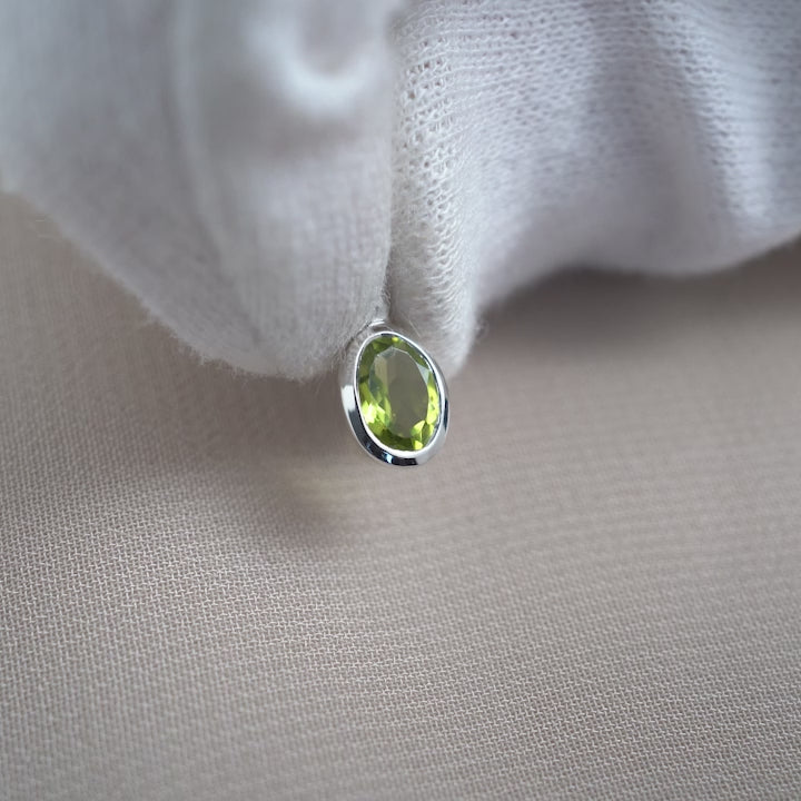 Green Peridot gemstone charm in silver. August birthstone charm in silver.