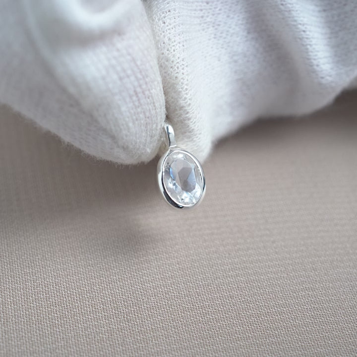 Silver gemstone charm with Clear Quartz. Crystal charm with Clear Quartz in sterling silver and classy design.
