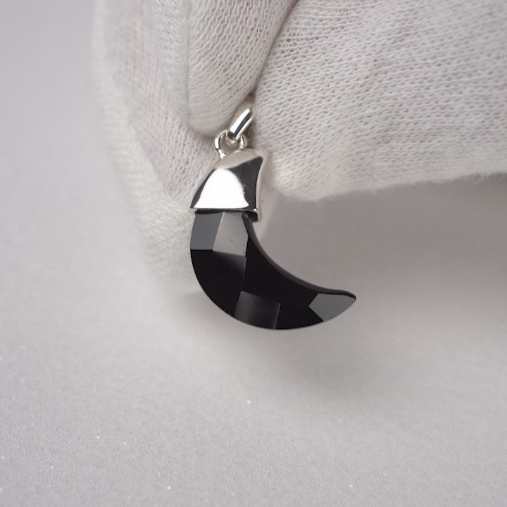 Moon shaped Onyx crystal in silver. Gemstone moon pendant with Onyx and sterling silver details.