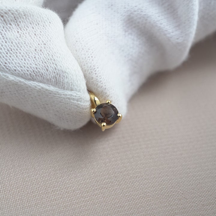 Gemstone charm with crystal Smoky quartz in gold. Jewelry with Smoky quartz that stands for protection.
