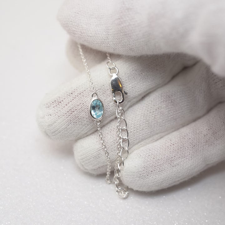 Silver bracelet with Blue Topaz the birthstone of December. Gemstone silver bracelet with Blue Topaz crystal.