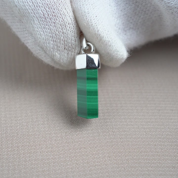 Malachite pendant in silver. Gemstone pendant with Malachite point in a natural shape with silver details.