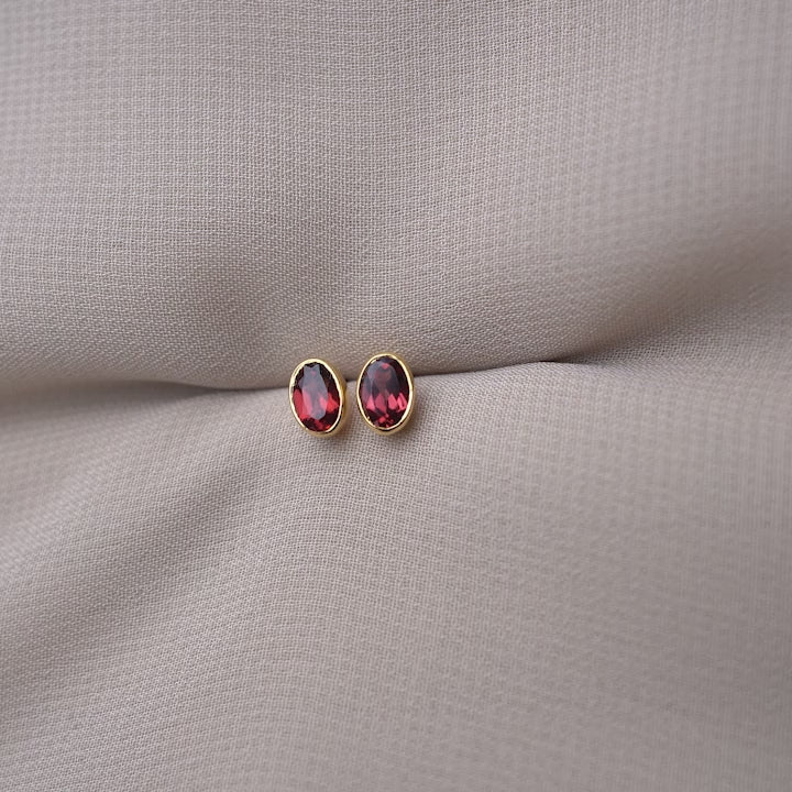 January birthstone earrings with red gemstone Garnet. Classy crystal earrings with Garnet in gold.