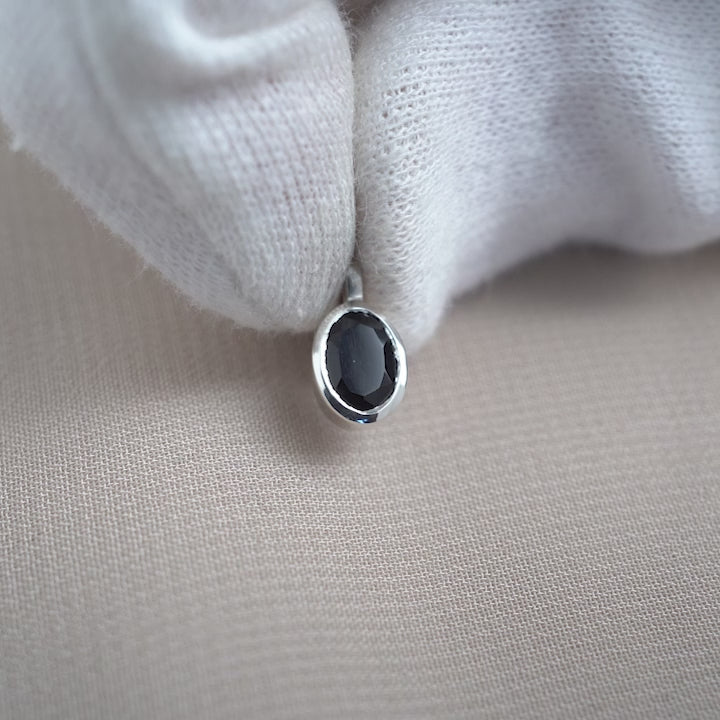 Onyx gemstone pendant in silver. Crystal jewelry pendant with Onyx, the birthstone of July.