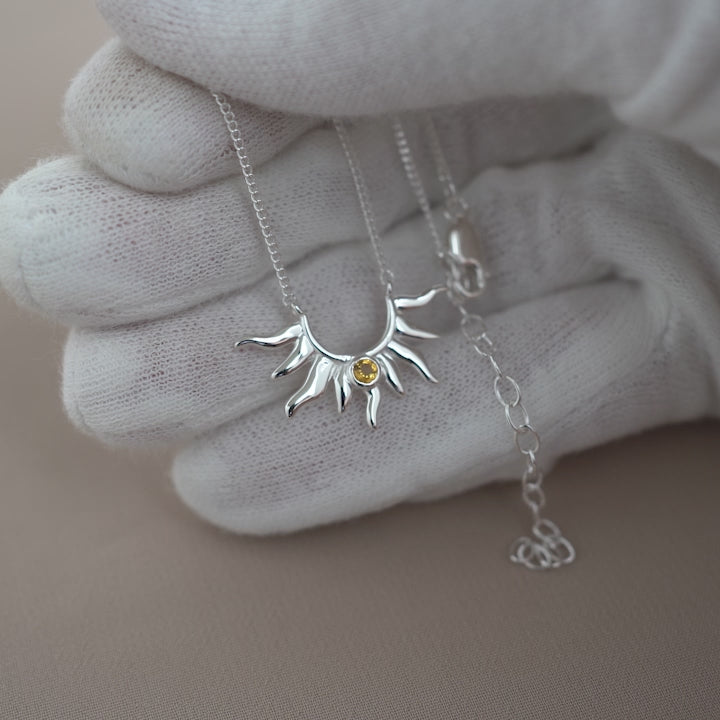 Beautiful silver necklace with a sun and small Citrine crystal. Sun necklace in silver and with a tiny sparkly Citrine gemstone.
