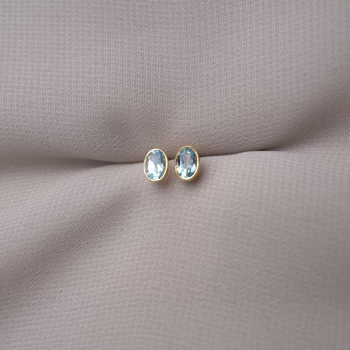 Gemstone earrings with Blue Topaz. Classy crystal earrings with Blue Topaz in gold.