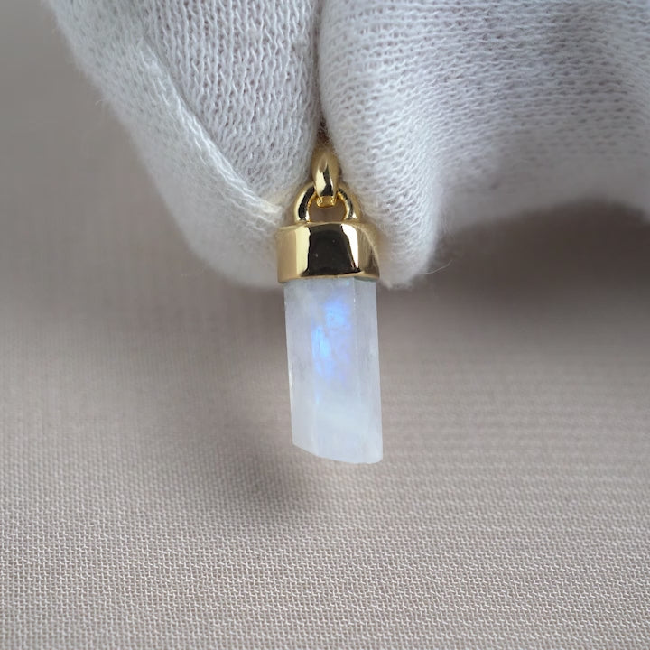 Crystal pendant with Moonstone tip with gold details. Crystal jewelry with Rainbow Moonstone that has a beautiful blue shimmer.