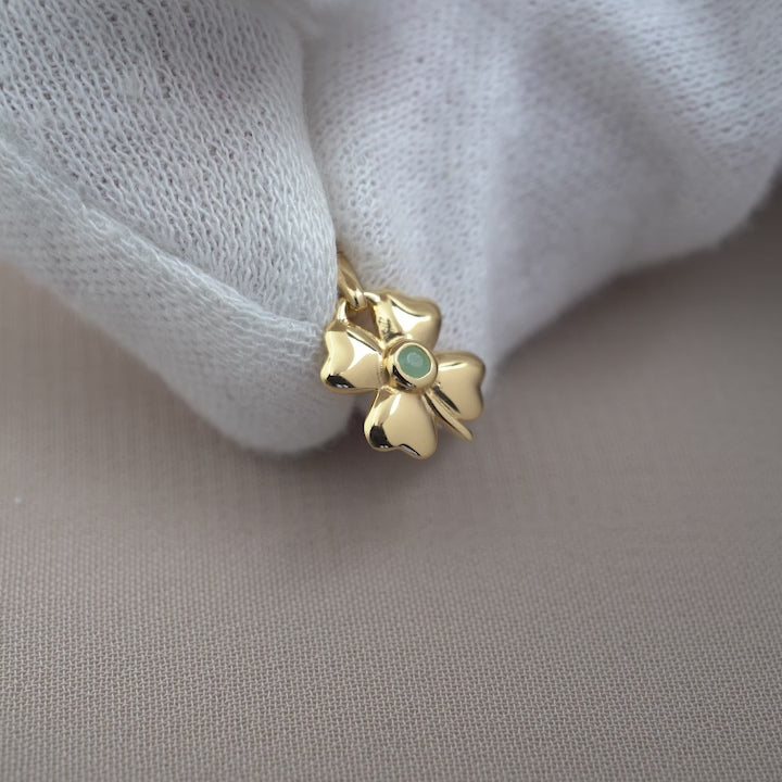 Gemstone jewelry with Chrysoprase in a Four-leaf clover symbol. Crystal pendant in gold with green gemstone Chrysoprase in four-leaf symbol.