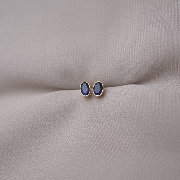Gemstone earrings with Iolite the birthstone of September. Crystal stud earrings with purple, blue Iolite gemstone.