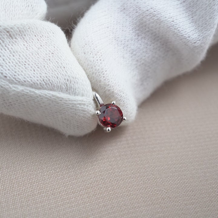 Classy crystal charm with red gemstone Garnet. Gemstone charm with Garnet the birthstone of January in sterling silver.