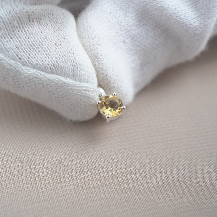Crystal charm with yellow gemstone Citrine which stands for happiness.