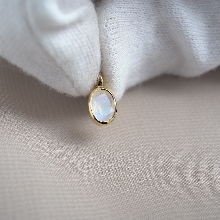 Rainbow Moonstone charm in gold. Crystal charm with Moonstone in gold that has a beautiful blue shimmer.