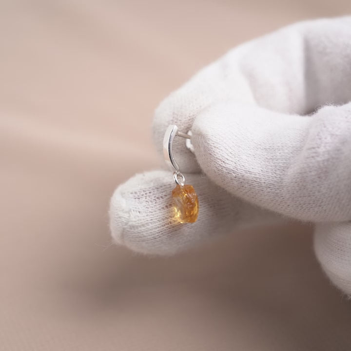 Earrings in silver with yellow crystal Citrine, which is November's birthstone. Silver earrings with yellow stone Citrine in a raw form.