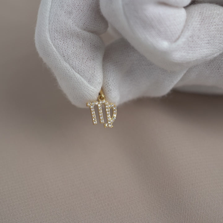 White Topaz charm in Virgo design. Zodiac charm in gold.