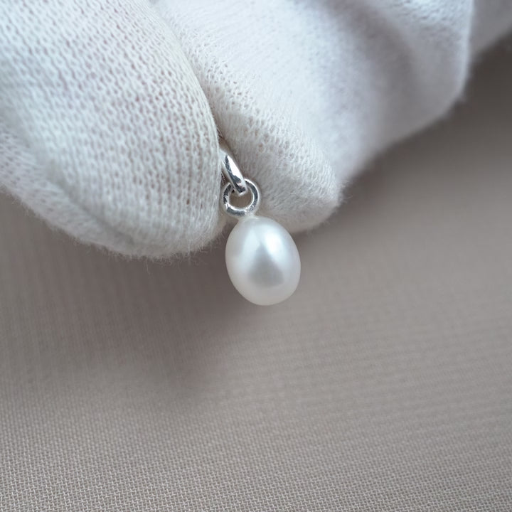 Freshwater pearl charm in silver. Beautiful pearl charm to have with your necklace.