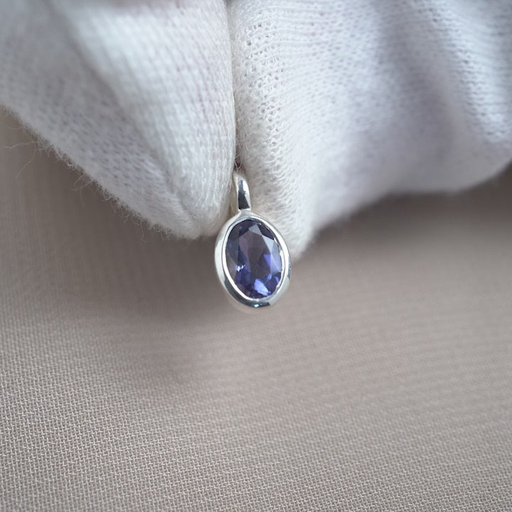 Iolite birthstone charm in silver. Crystal jewelry with Iolite charm in sterling silver for necklace.