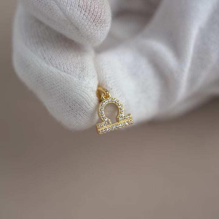 White Topaz  charm with Leo (Lion) symbol. Zodiac sign charm with sparkly crystals in gold.