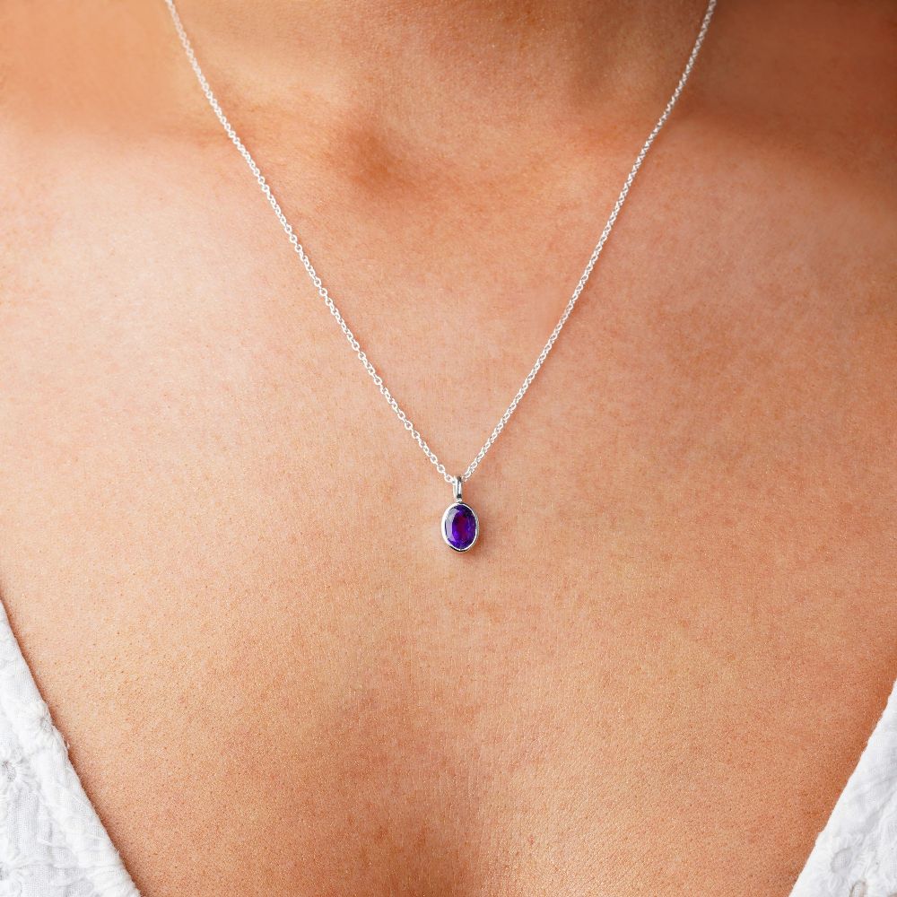 Necklace with purple gemstone Amethyst which is a protective stone. Jewelry with purple crystal Amethyst, which is the birthstone of February.