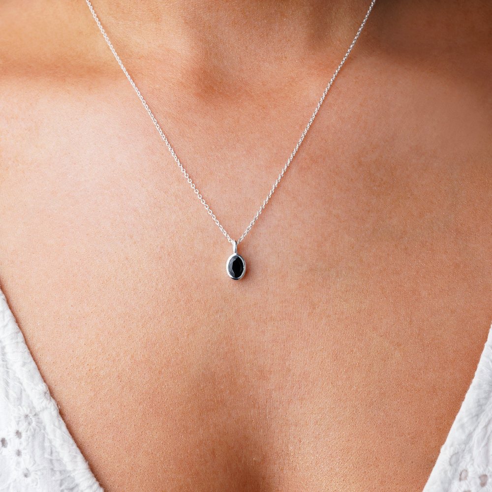 Black crystal Onyx which is the birthstone for July. Jewelry with Onyx, a beautiful and powerful black gemstone.