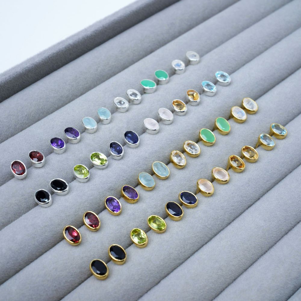 Jewelry with all the year's birthstones as earrings. Earrings with the year's birthstones in silver and gold.