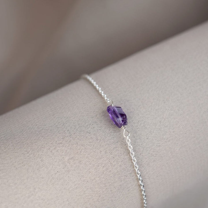  Raw Amethyst in silver bracelet. Crystal bracelet with raw Amethyst gemstone that has a beautiful purple color.