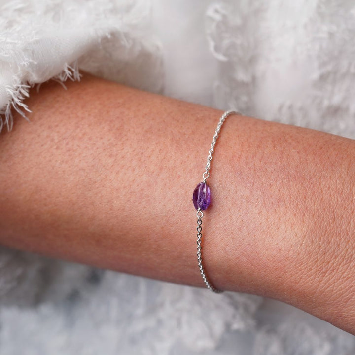 Silver bracelet with Amethyst crystal in raw form. Crystal bracelet with raw Amethyst in beautiful purple color.