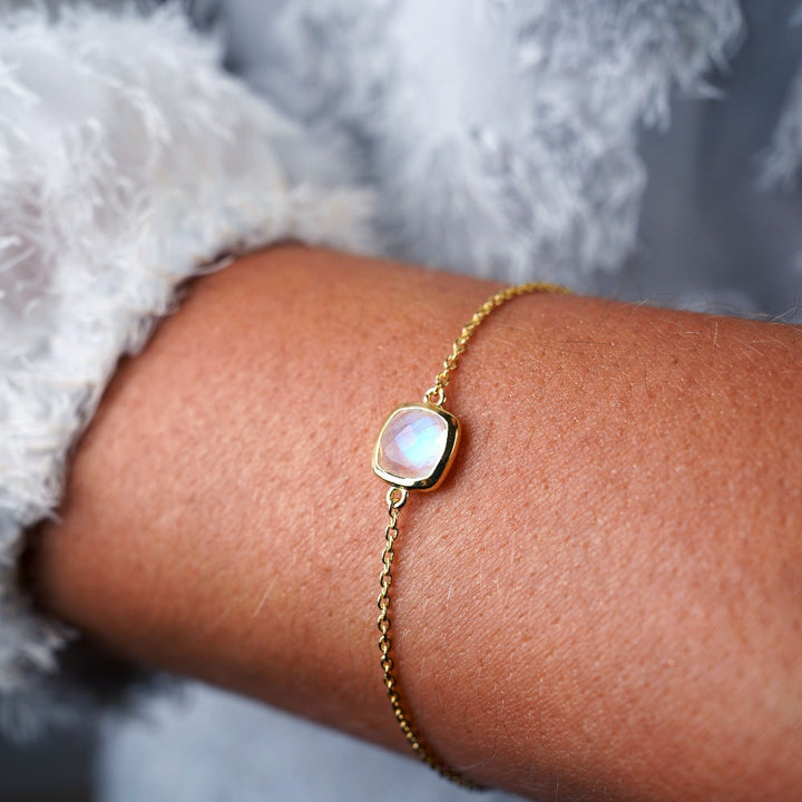 Crystal bracelet with Moonstone that has a blue shimmer. Gold bracelet with Rainbow Moonstone, which is June's birthstone and has a beautiful shimmer.