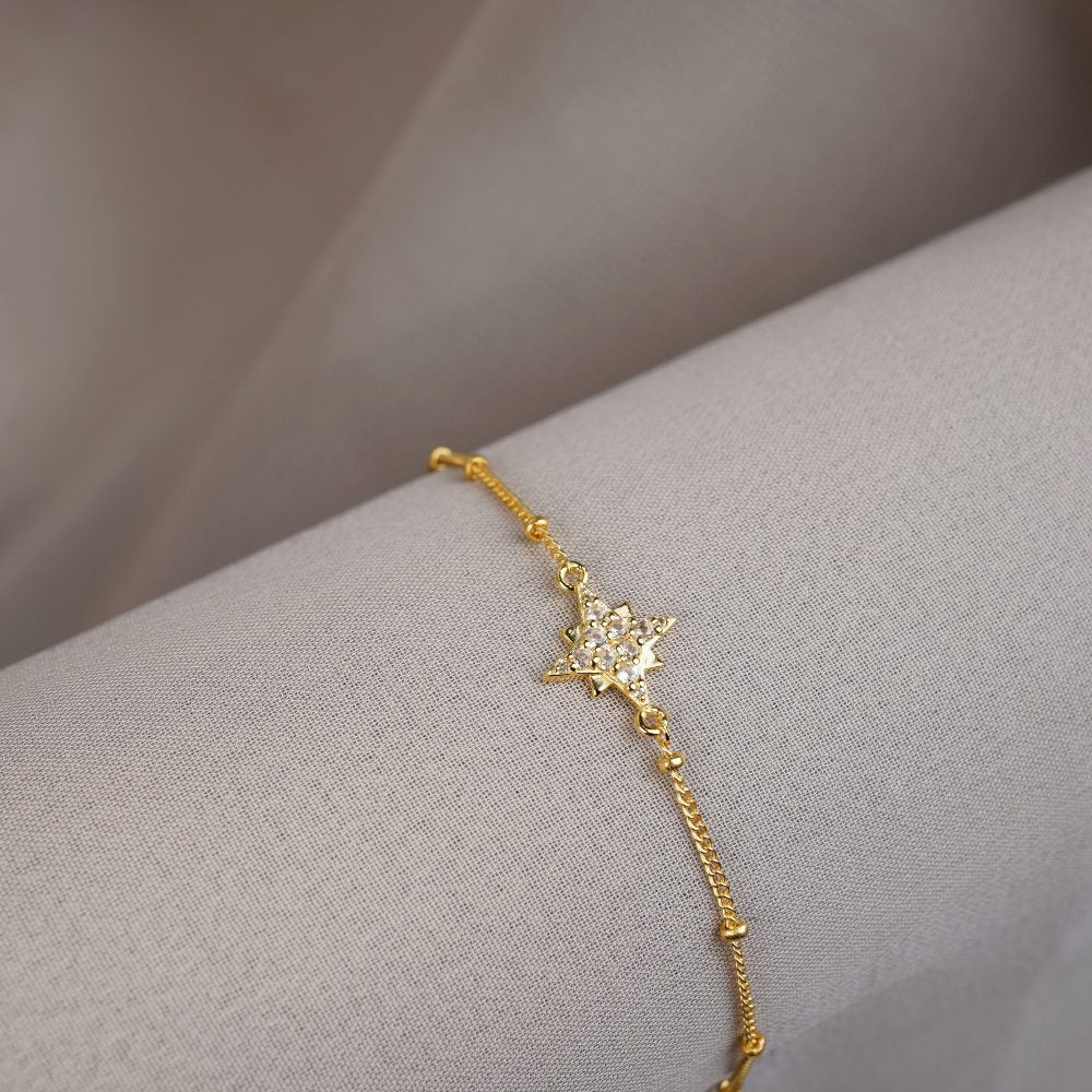 Gold bracelet with star of crystals. Beautiful Star bracelet in gold and with White Topaz gemstones. 