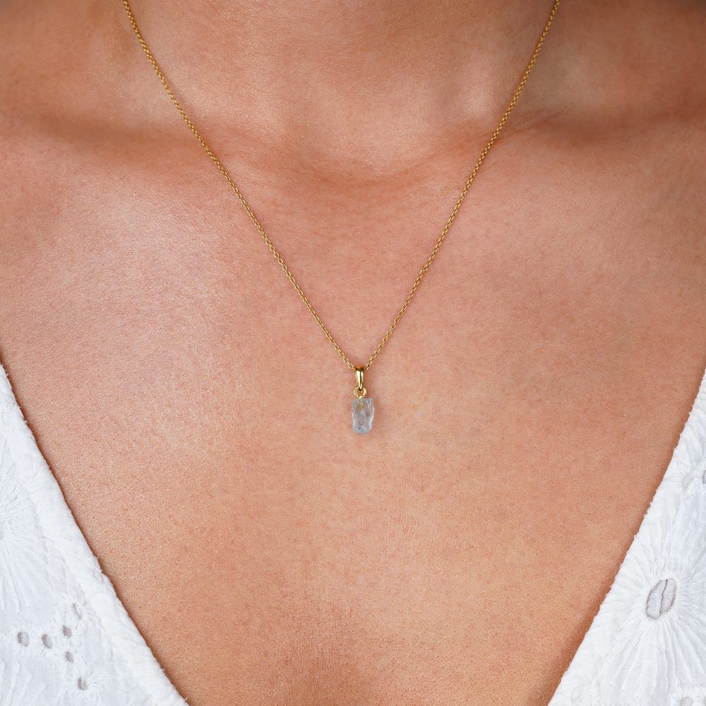  Necklace with blue gemstone Aquamarine. Gold necklace with blue crystal Aquamarine which symbolizes communication.