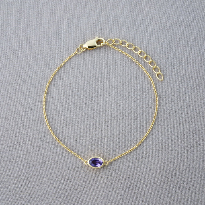 Gold bracelet with February birthstone Amethyst. Crystal bracelet with purple crystal Amethyst.