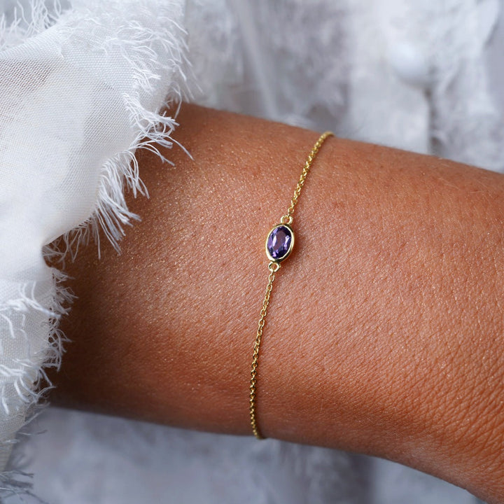 Bracelet with February birthstone Amethyst. Gold bracelet with purple crystal Amethyst.