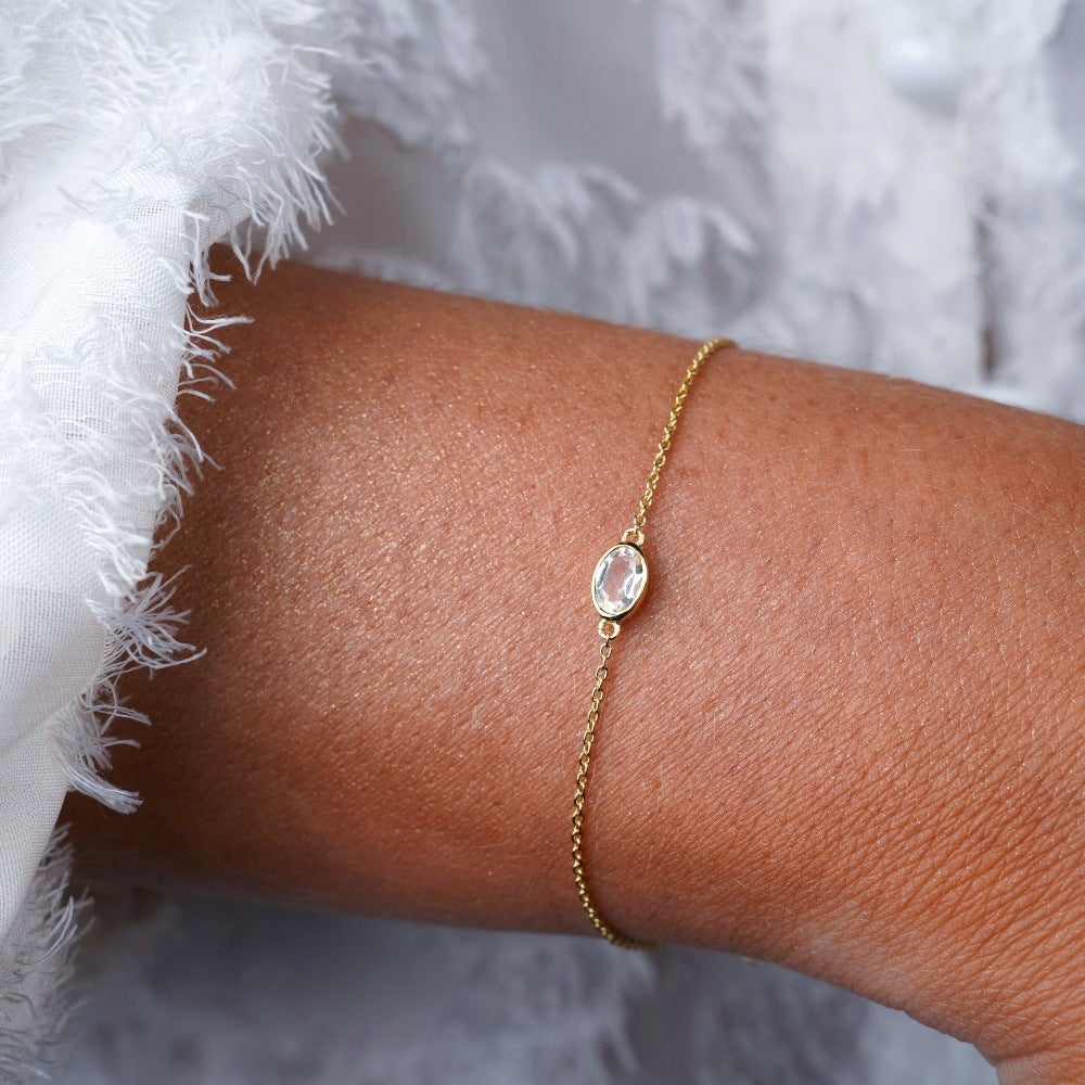 Bracelet with crystal Clear Quartz which is birthstone of April. Gold bracelet with Clear Quartz.