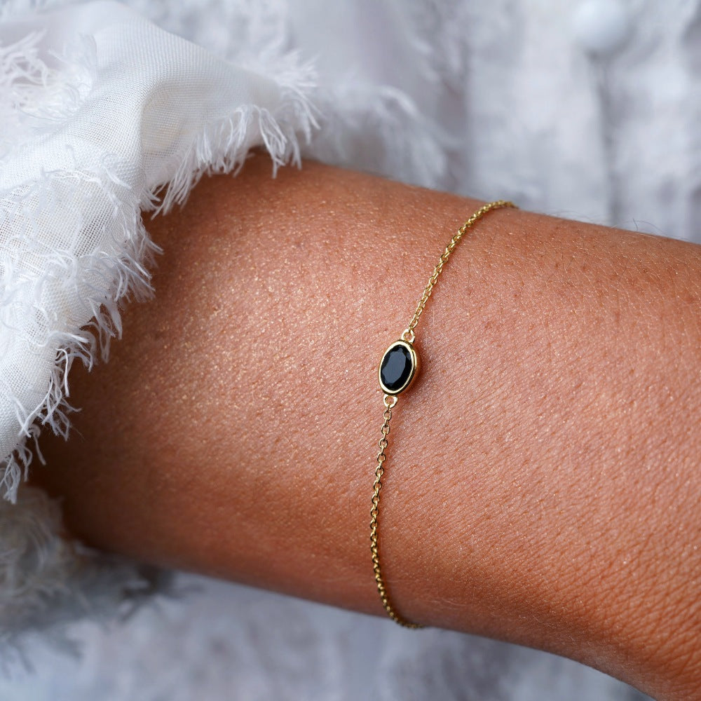 Gold bracelet with black crystal Onyx. Bracelet with July birthstone Onyx.