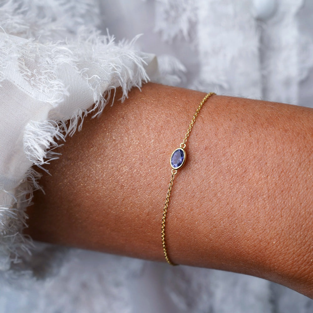 Gold bracelet with crystal Iolite, September birthstone. Crystal bracelet with September birthstone Iolite in gold.