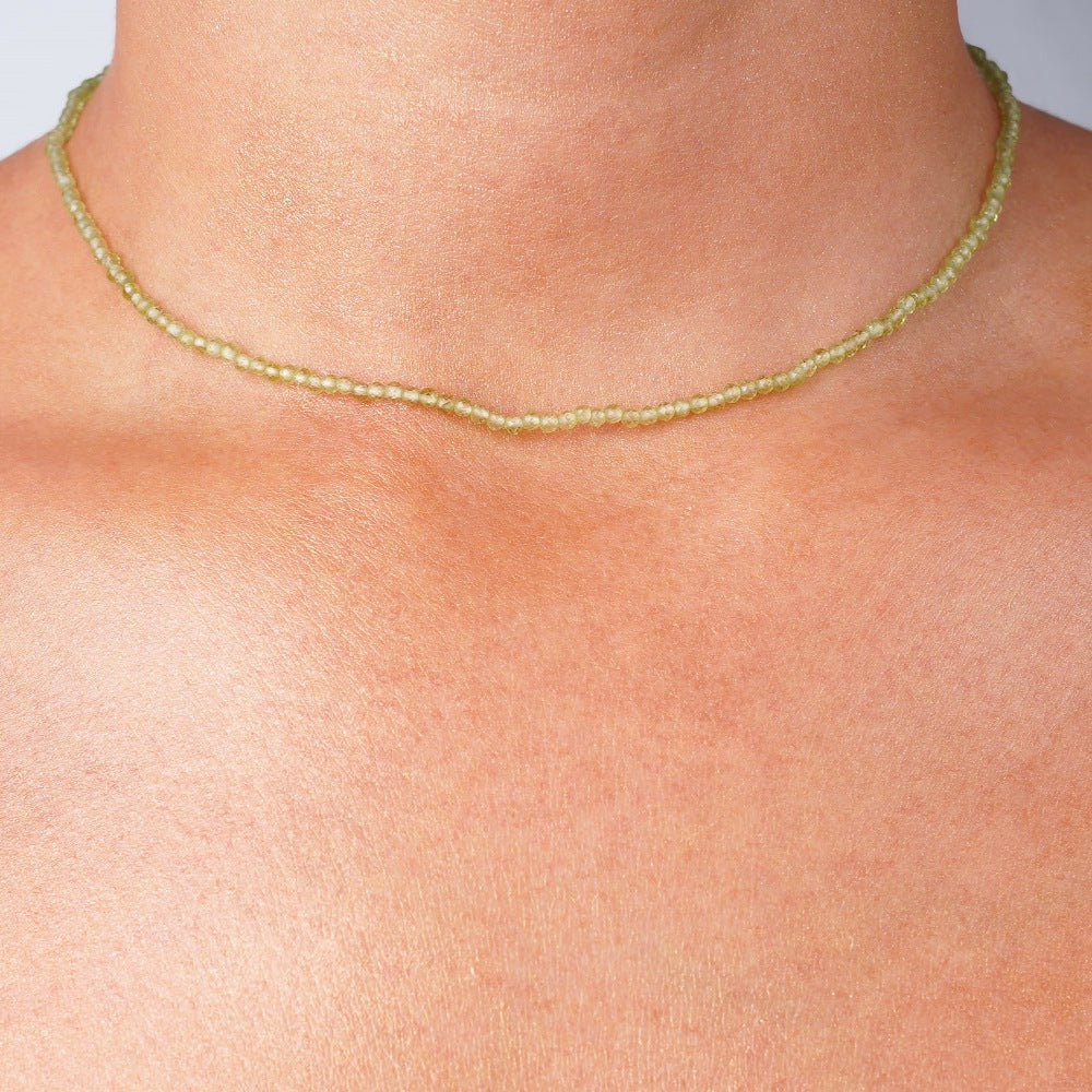 Necklace with Peridot which is a green crystal and August birthstone. Peridot necklace in gold.