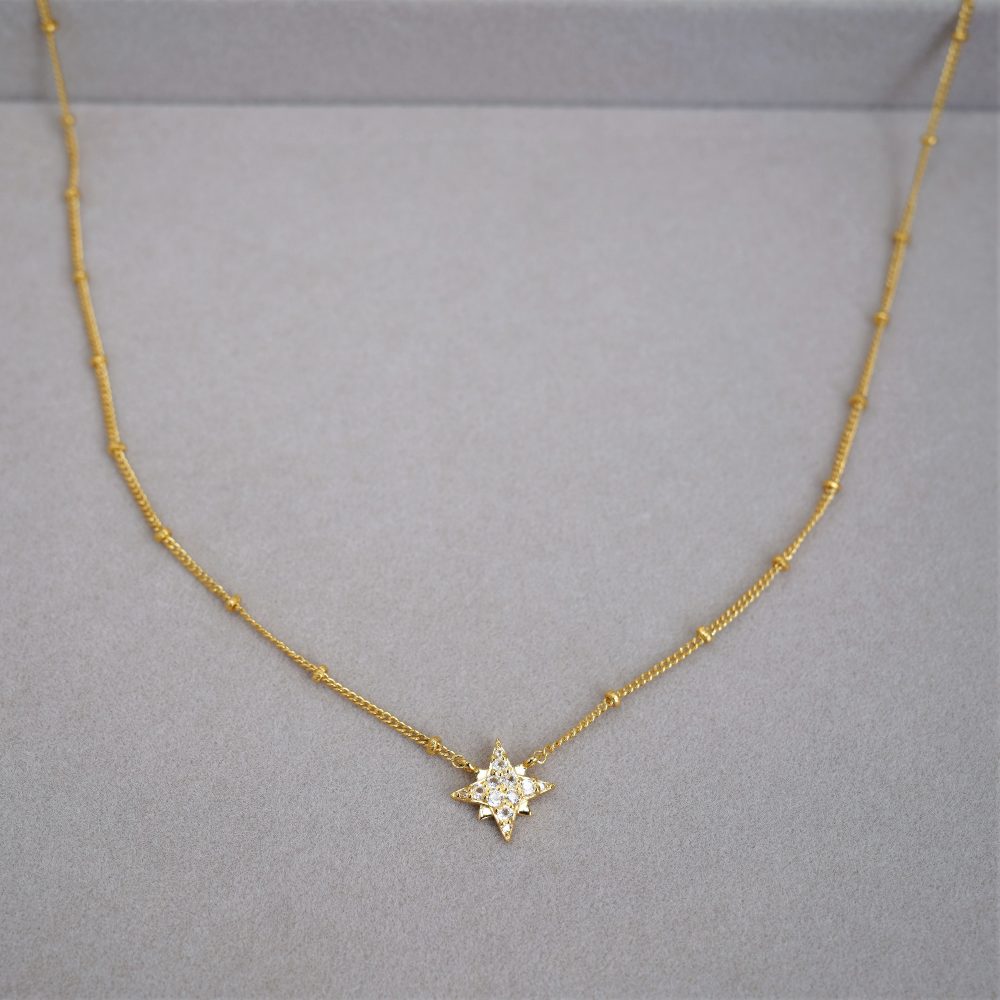 Crystal necklace with star in gold and real crystals. Star necklace with genuine White Topaz gemstones.